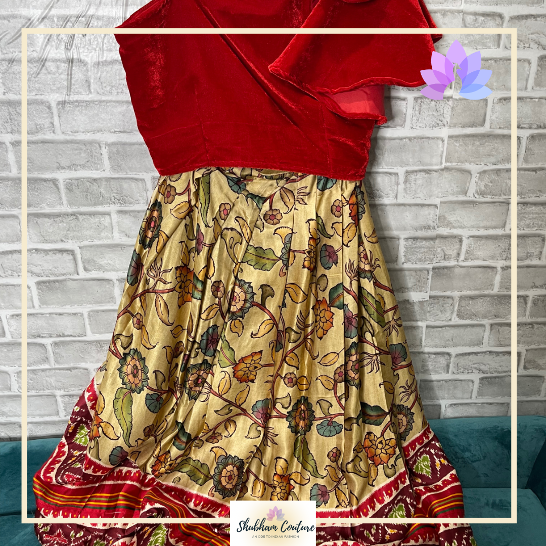 Simple Kalamkari printed satin lehanga with one shoulder ruffle croptop
